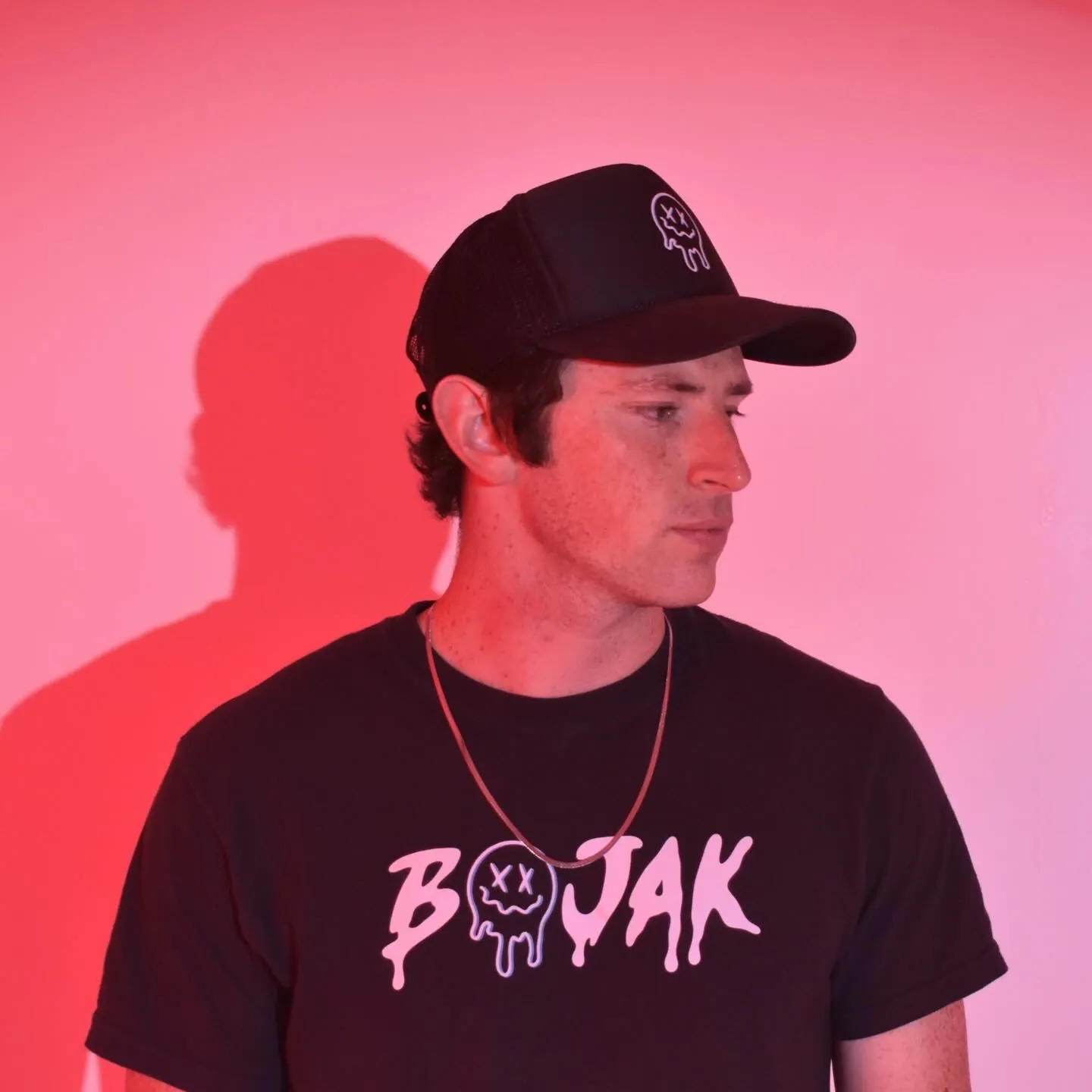 BOJAK portrait wearing BOJAK shirt and hat