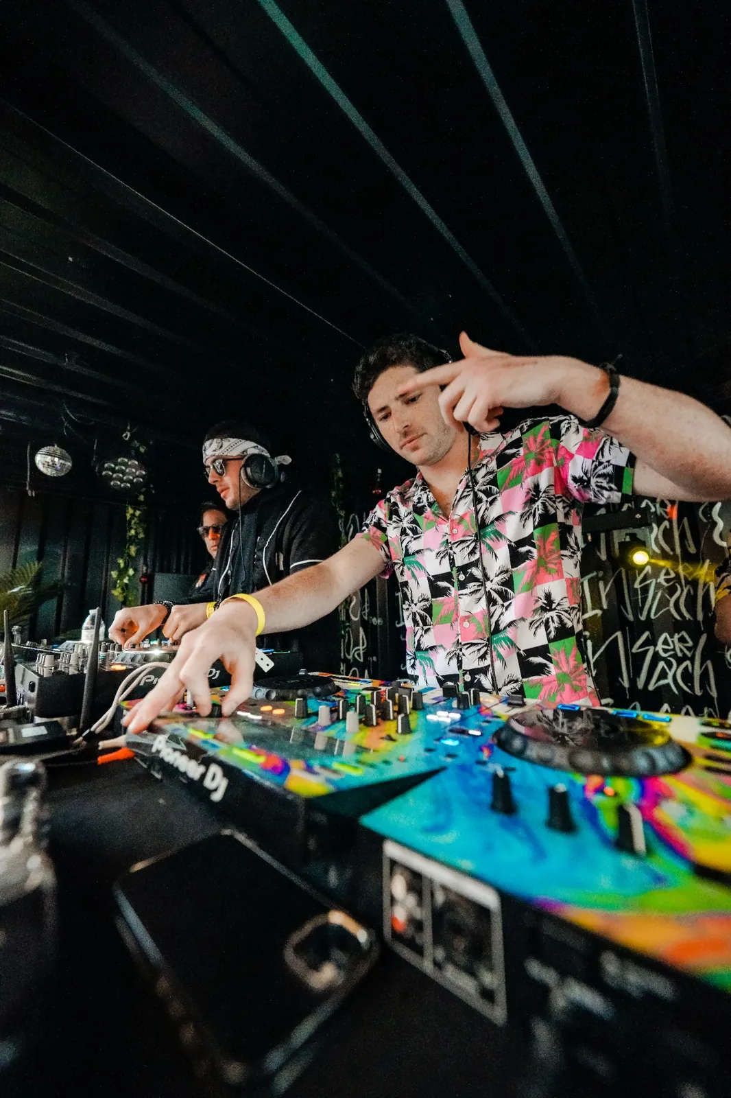 BOJAK mixing on colorful DJ equipment