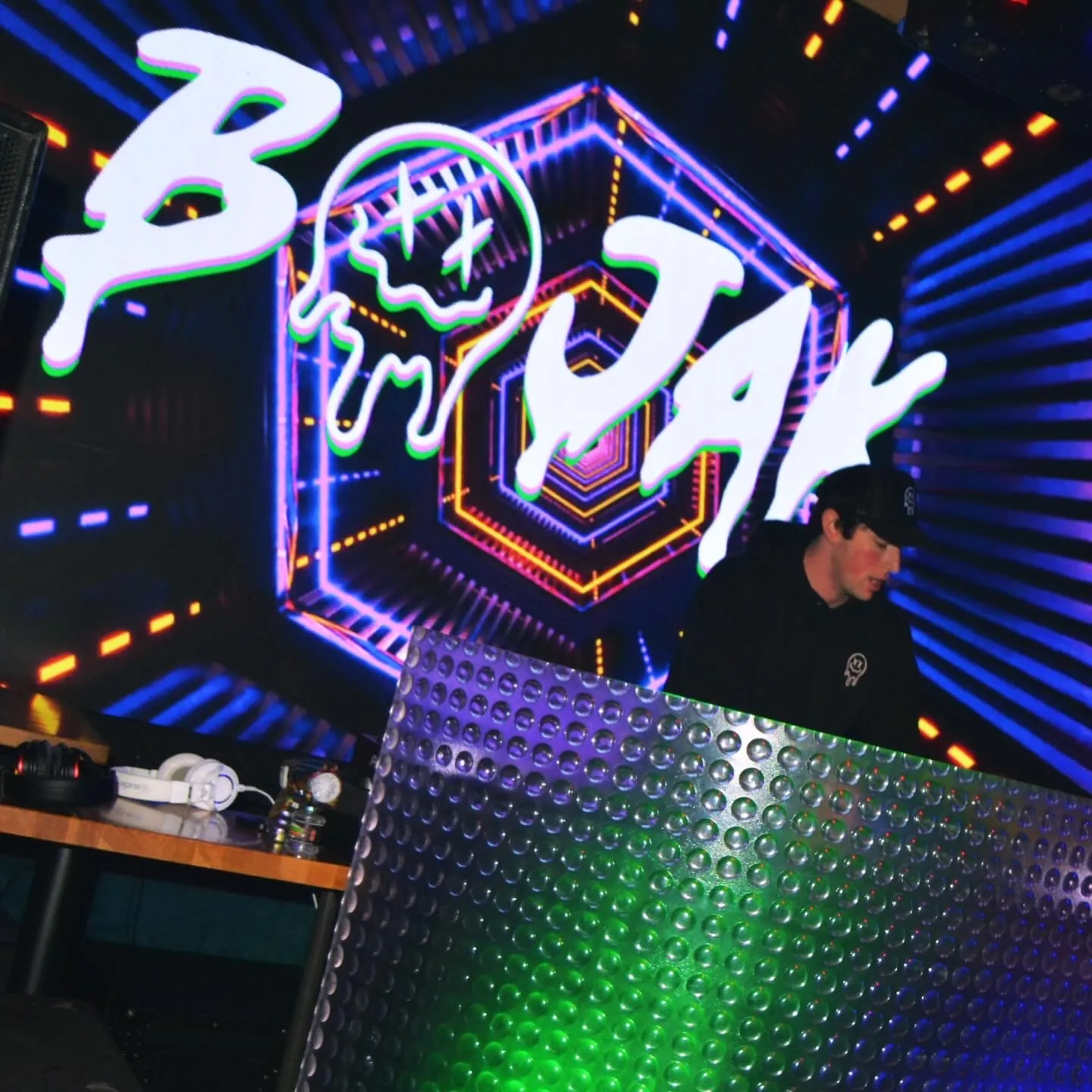 BOJAK performing in front of stage visuals